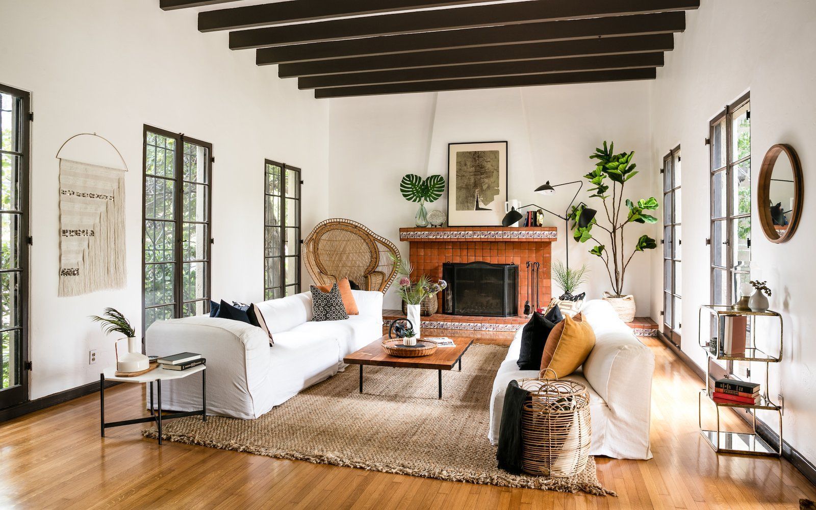 A living room filled with furniture and a fireplace.