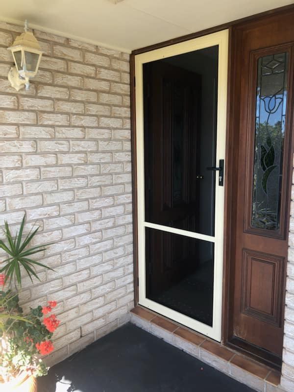 Exterior View of a Silver Door With a Security Screen Door — Screen Factory In Billinudgel, NSW