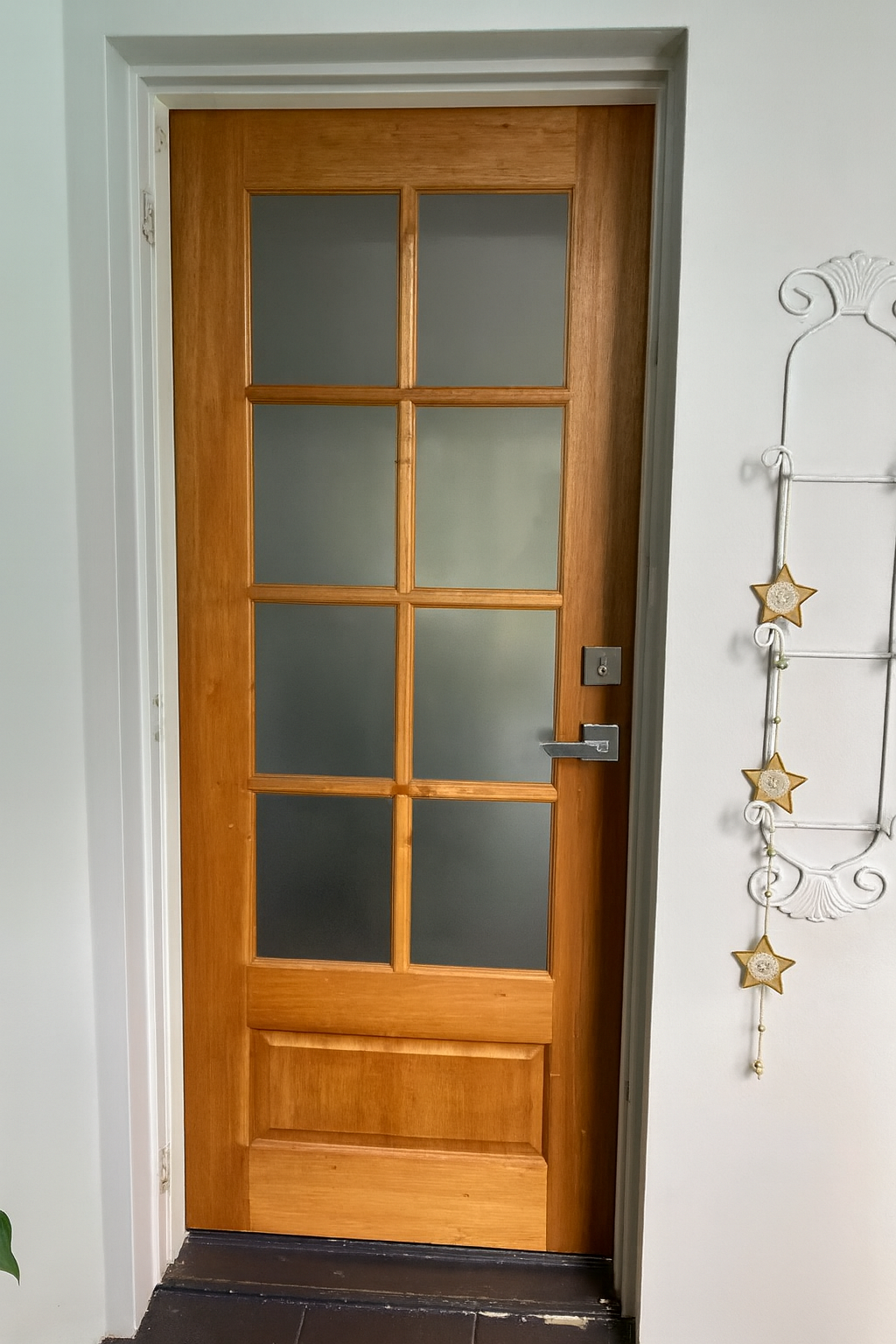 A Wooden Door With Frosted Glass And A Hanging Decoration On The Wall — Screen Factory In Ocean Shores, NSW
