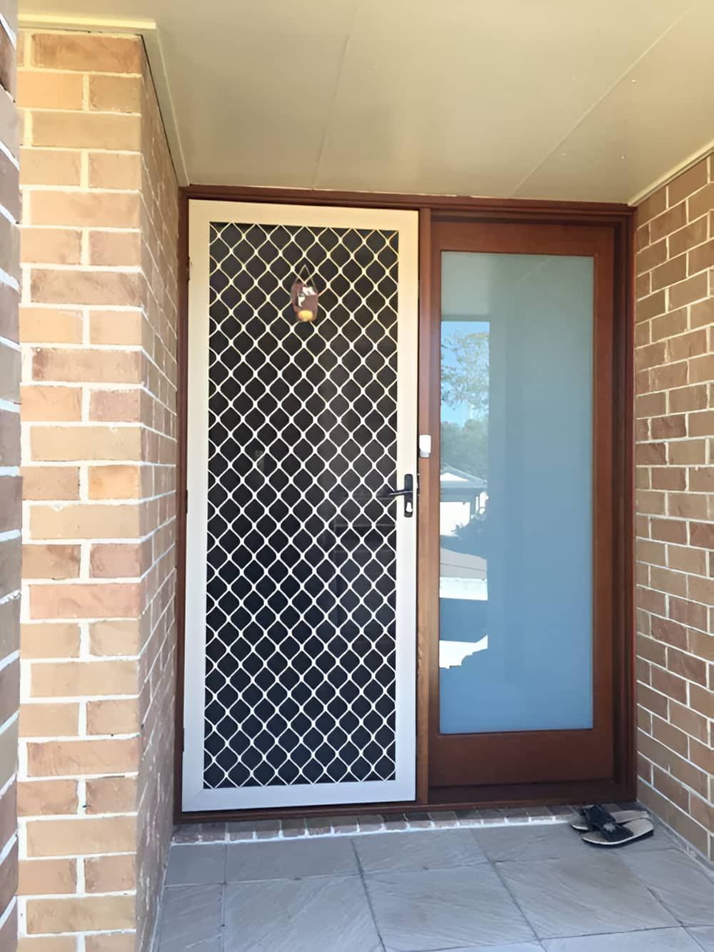 A Door With A Brick Wall Behind It — Screen Factory In Ocean Shores, NSW