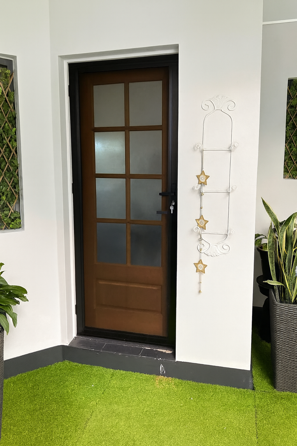 A Door With A Ladder Hanging On The Wall Next To It — Screen Factory In Ocean Shores, NSW