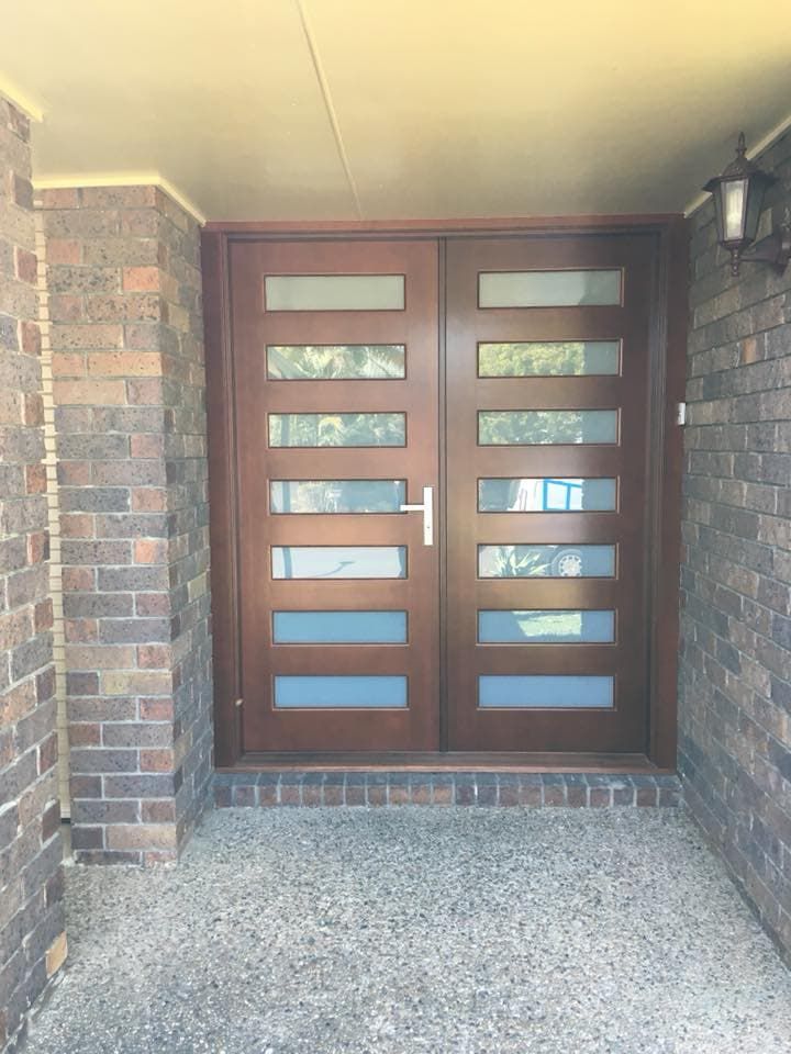 A Wooden Door With A Lot Of Windows On A Brick Wall — Screen Factory In Ocean Shores, NSW