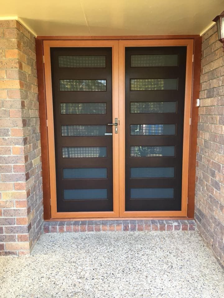 A Double Door With A Brick Wall Behind It — Screen Factory In Ocean Shores, NSW
