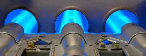 Blue flames burning inside a furnace.
