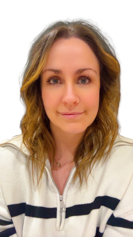 Portrait of a person with wavy brown hair wearing a white sweater with dark stripes, against a white background