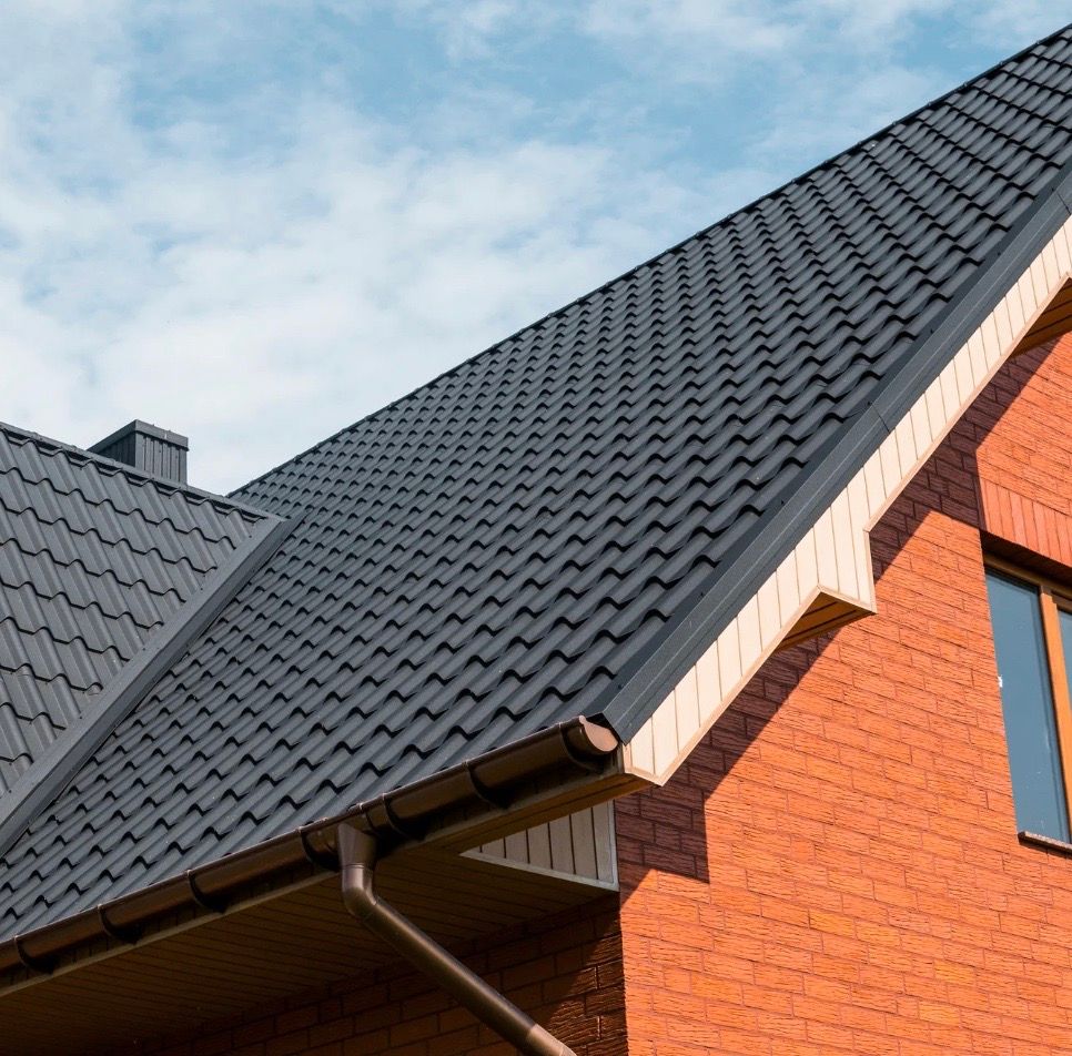 The side of a home with shingles roofing.