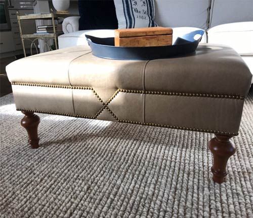 A coffee table with a tray on top of it