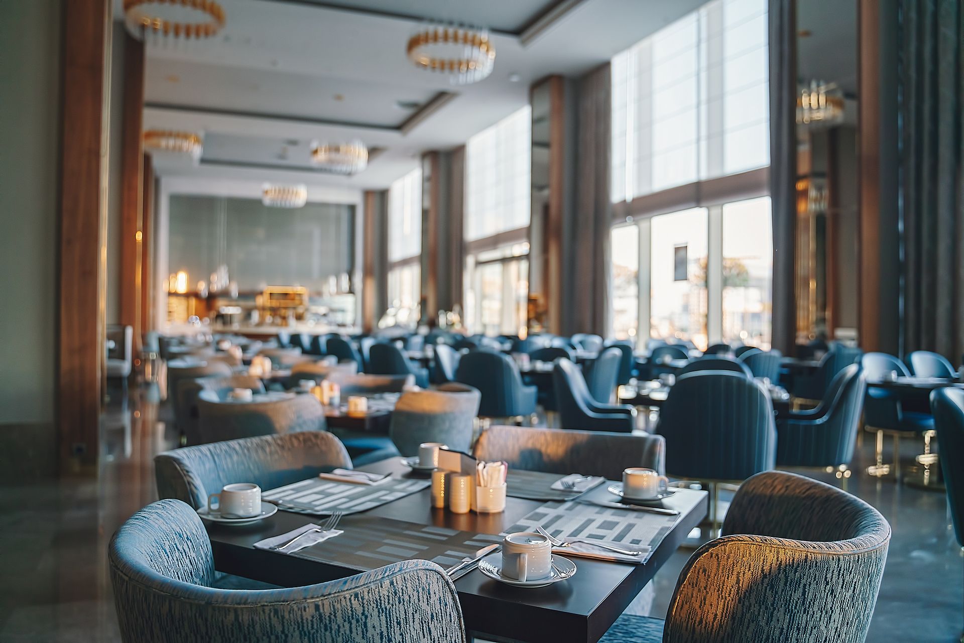 There are many tables and chairs in the restaurant.