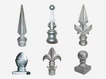 Six silver metal fence post finials in various decorative shapes.