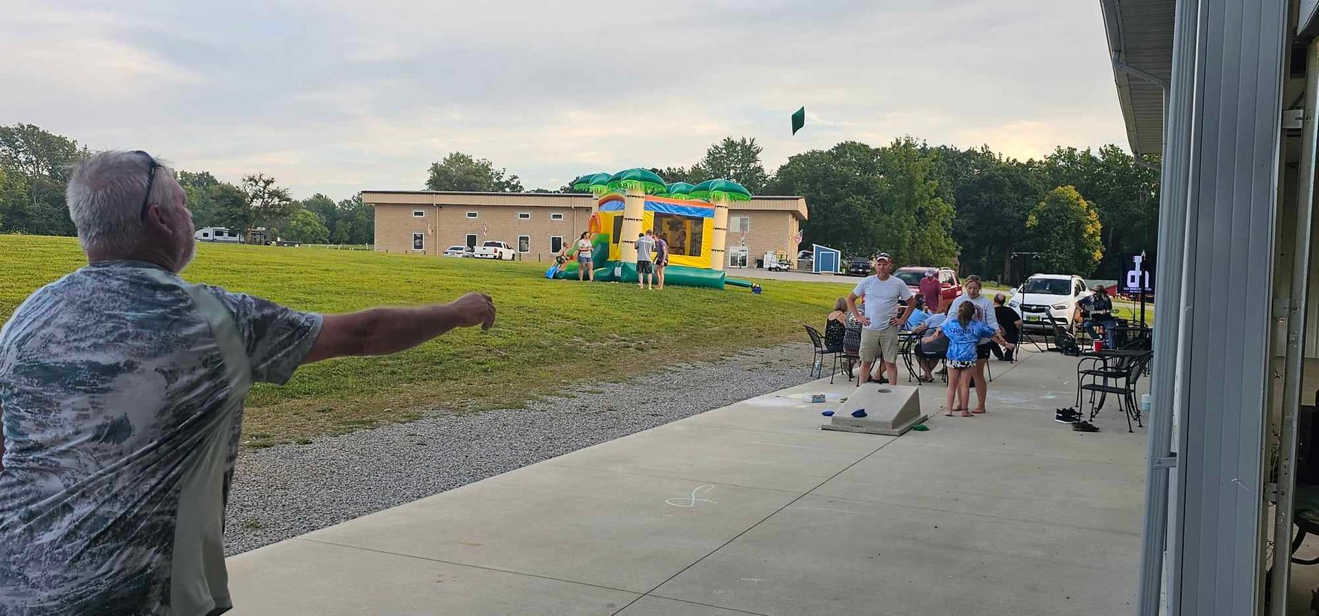 a man stands in front of a bouncy house