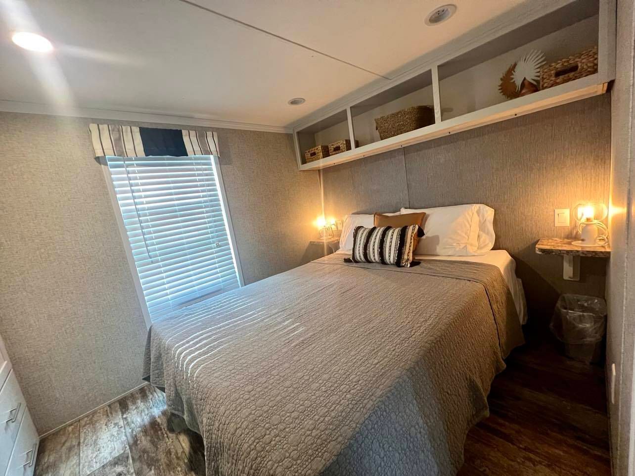 a small bedroom with a bed and a window