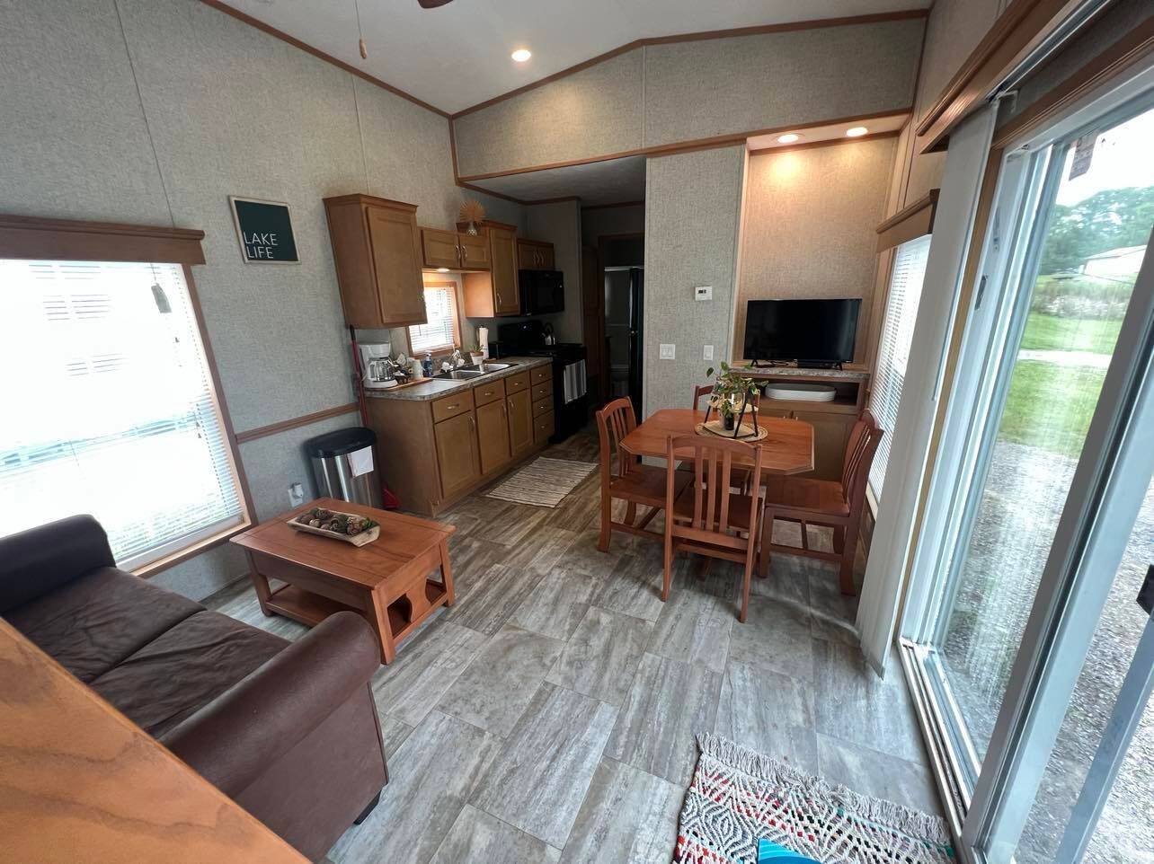 a living room with a sign that says lake life