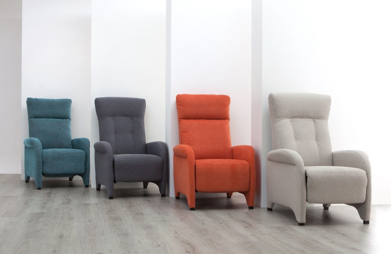 Four Colorful Chairs Are Lined Up In A Row On A Wooden Floor — Ocean Charm Upholstery In Southport, QLD