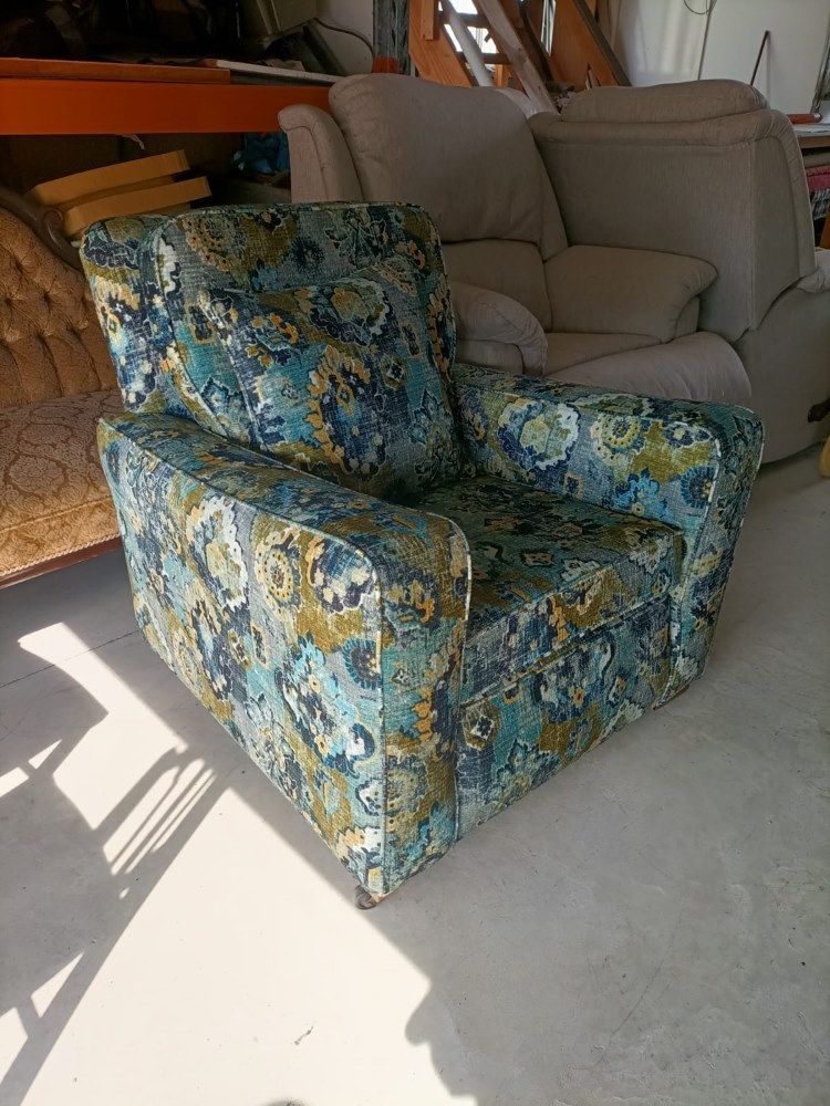 A Chair With A Floral Pattern Is Sitting In A Room Next To A Couch — Ocean Charm Upholstery In Southport, QLD