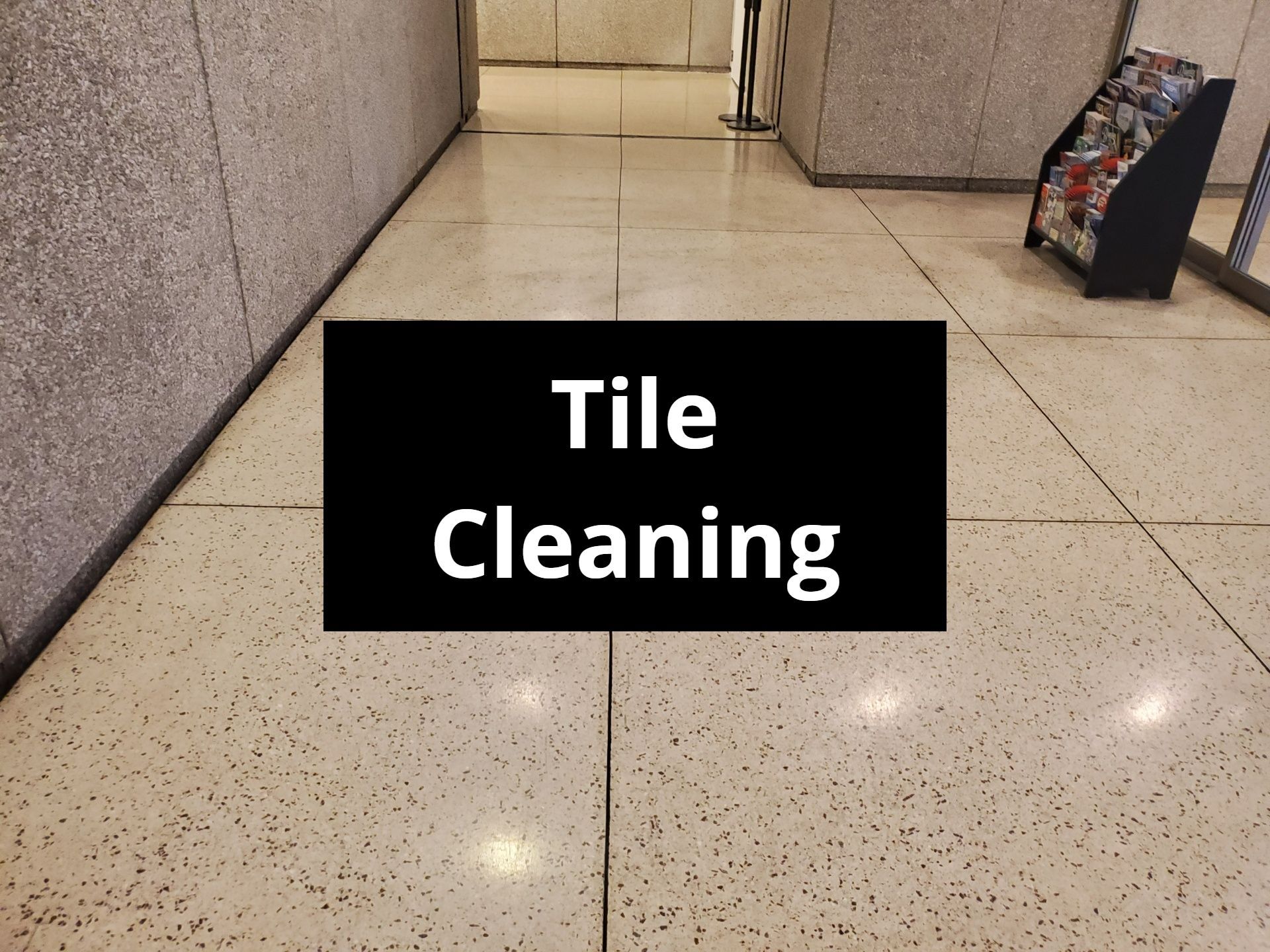 Black sign on floor: