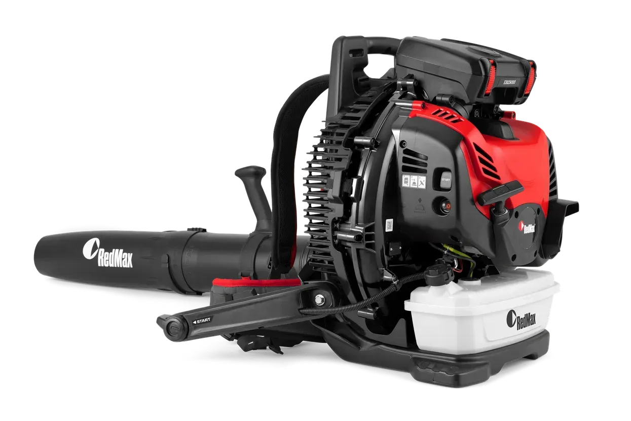 Red and black leaf blower/vacuum with long nozzle and white collection bag on a white background