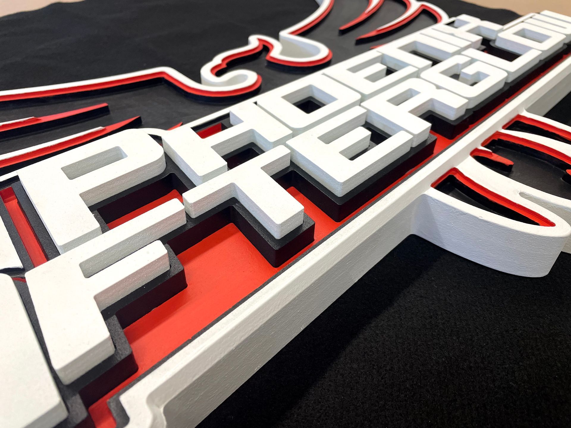 A red white and black sign that says phoenix 