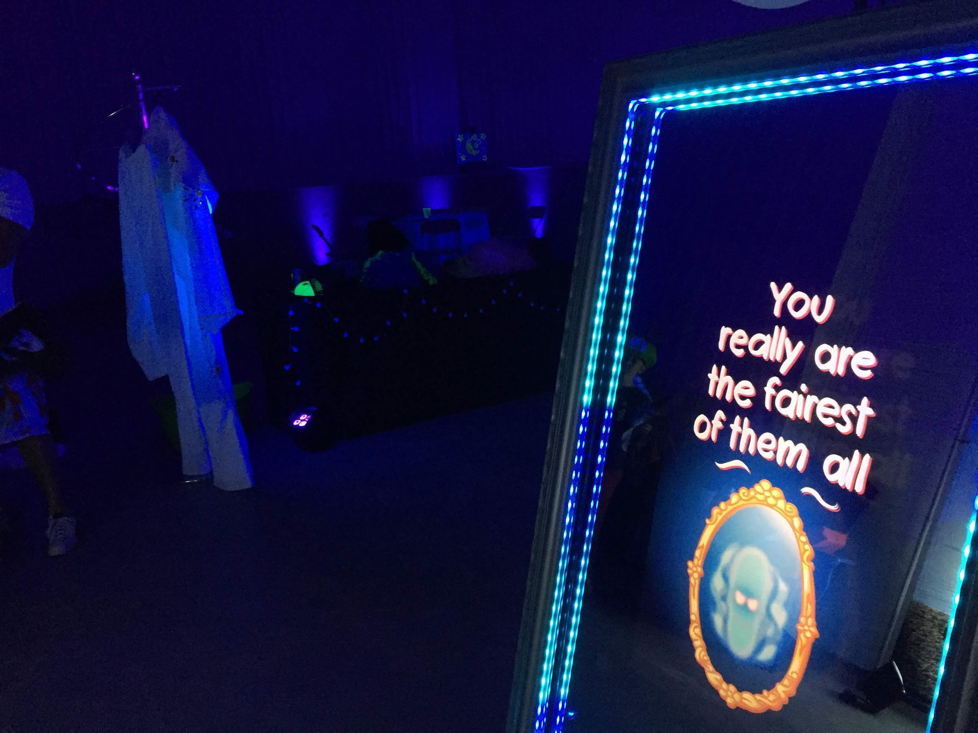 A mirror with illuminated frame, text reads 