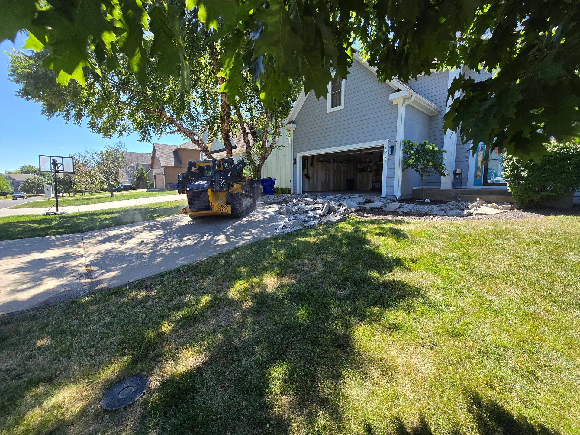 Concrete driveway replacement in a residential neighborhood