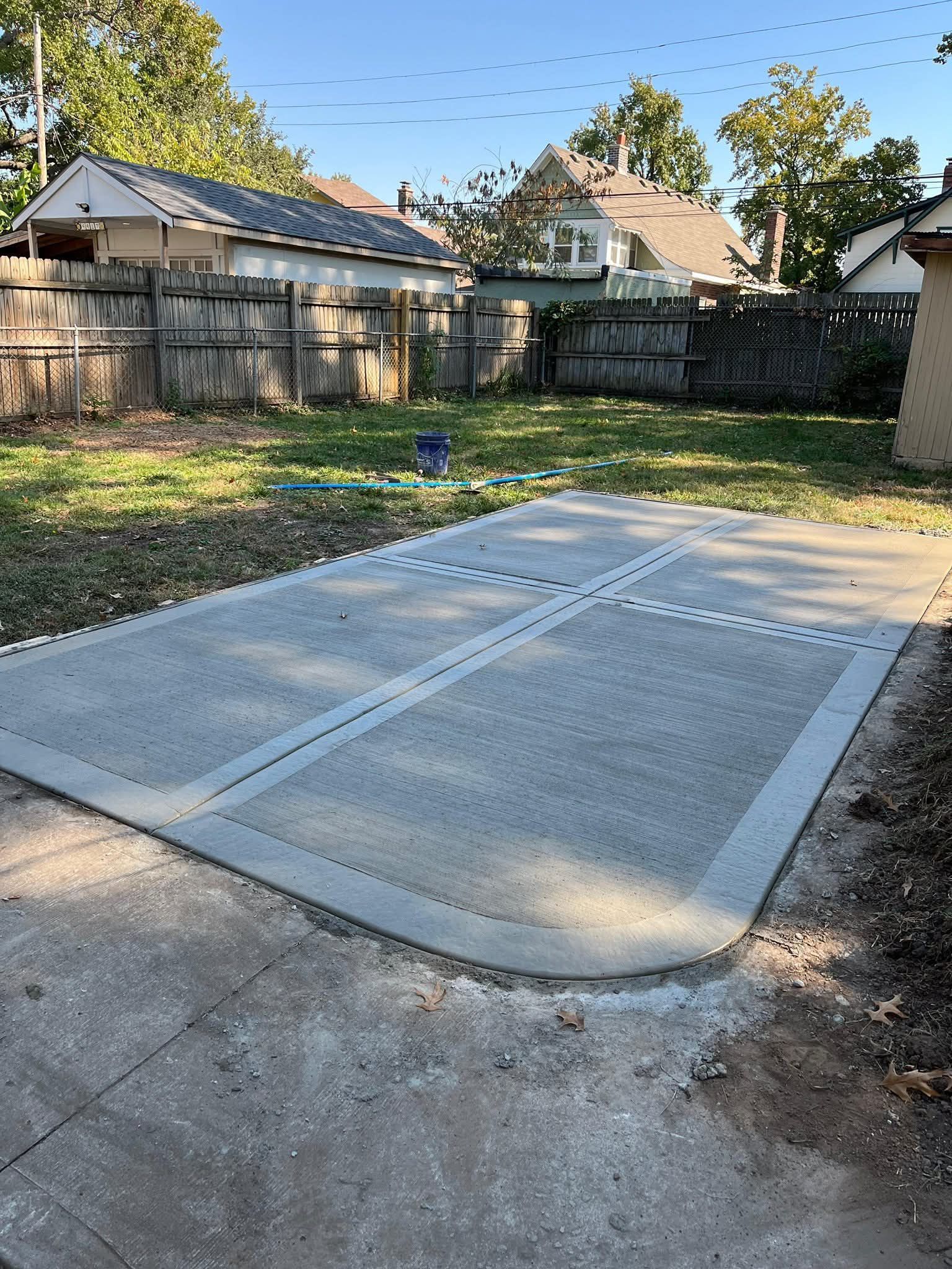 Concrete patio slab in a backyard