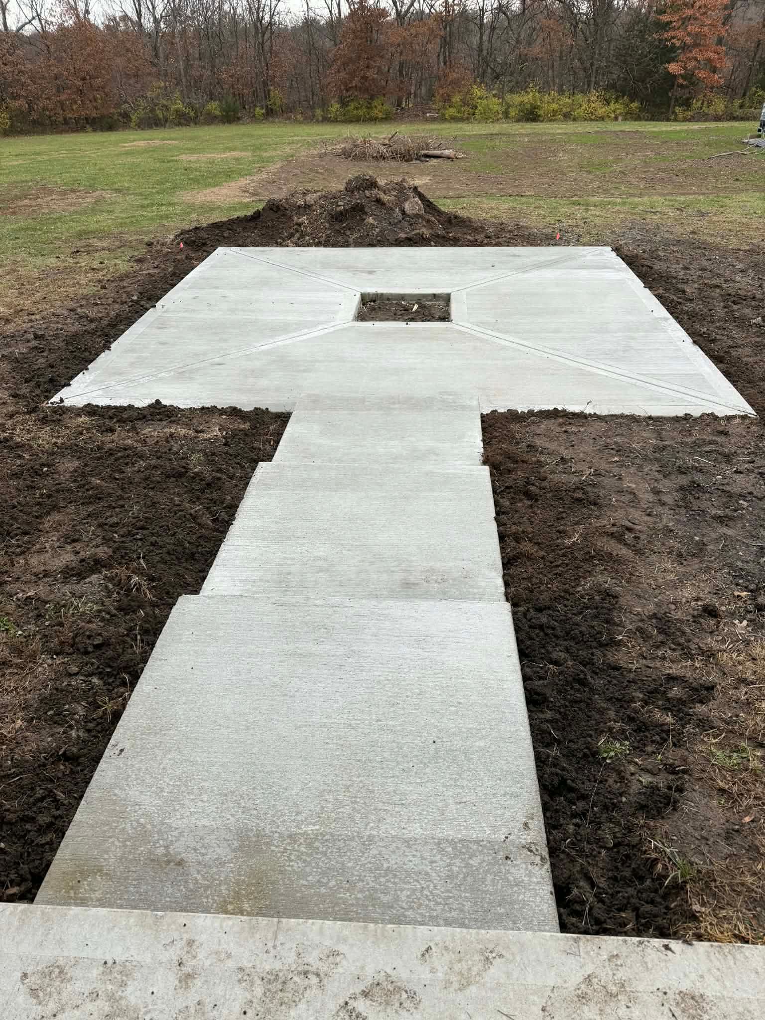 New concrete sidewalk and driveway slab installation