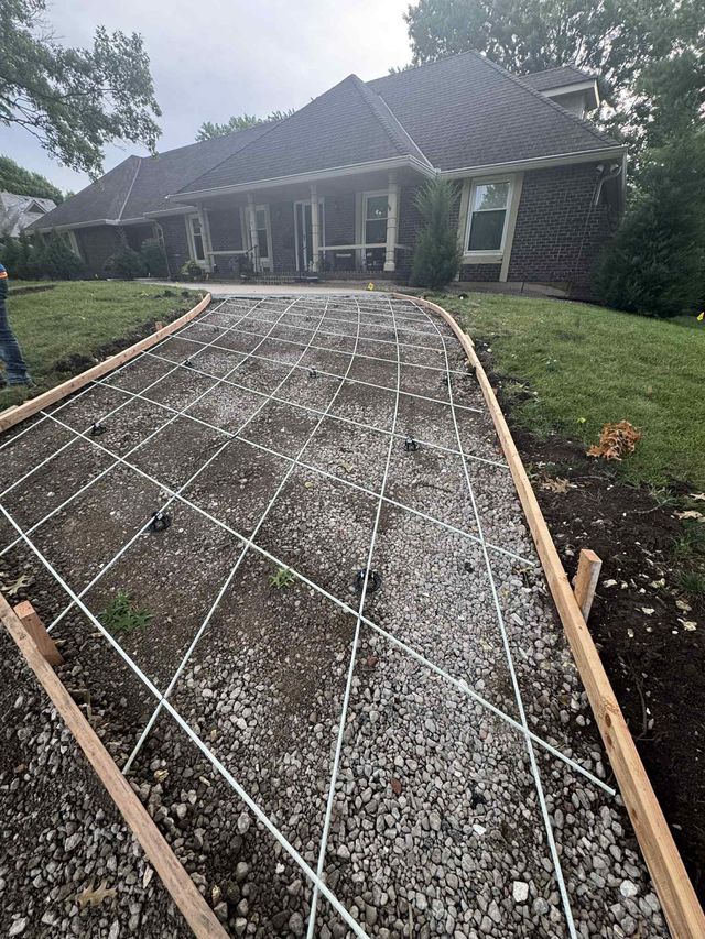 Rough gravel walkway under construction leading to a house