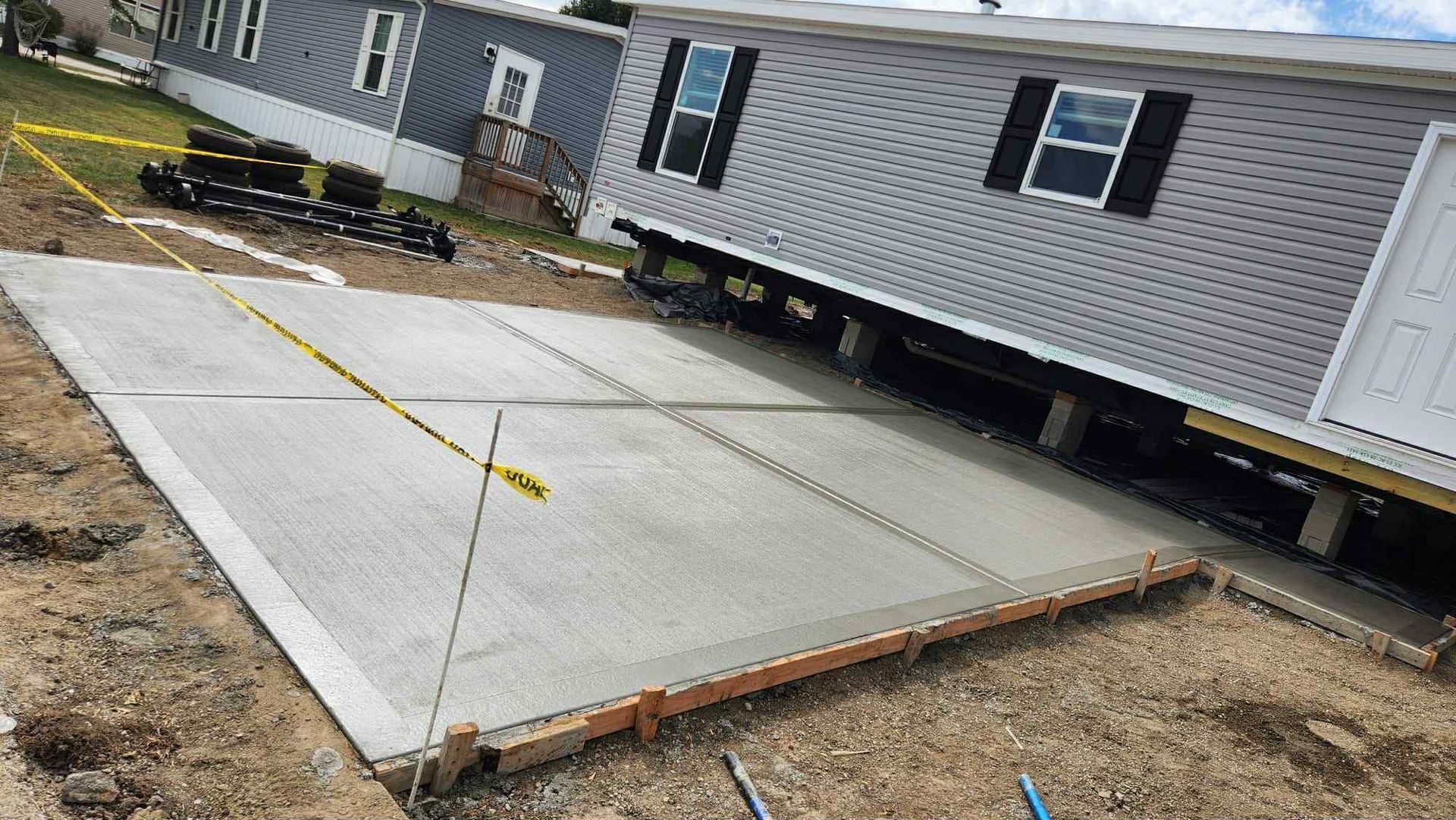 Concrete driveway slab beside