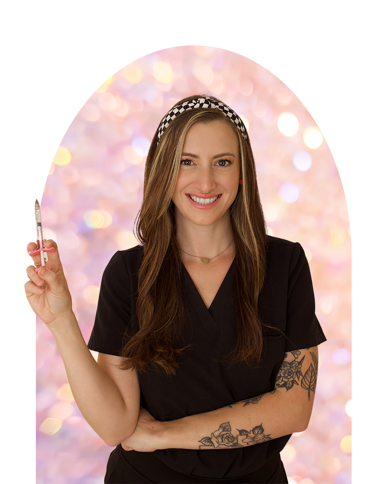 A woman in a black scrub top is holding a pen in her hand.