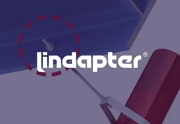 Lindapter logo on a purple background with a red dashed circle and metallic shapes