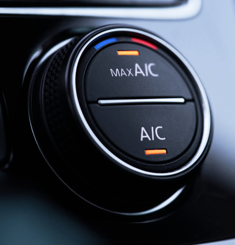 Close-up of a vehicle air conditioning control dial with MAX A/C and A/C settings.