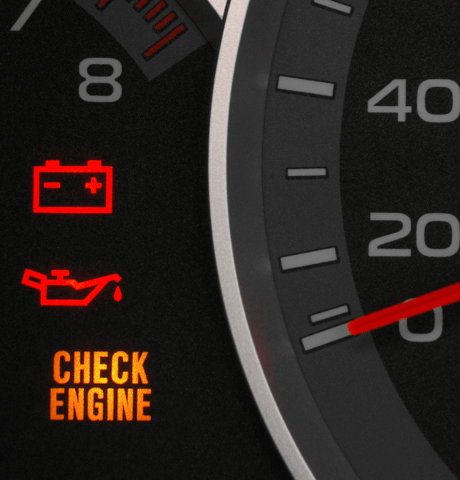 Dashboard displaying illuminated battery, oil pressure, and check engine warning lights.