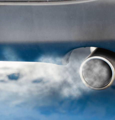 Exhaust fumes coming from a vehicle tailpipe.