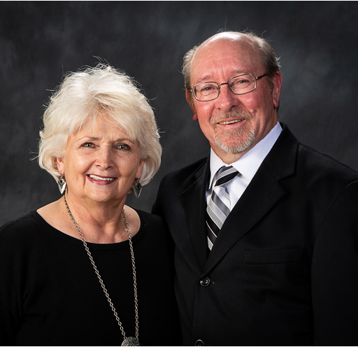 A man and a woman are posing for a picture together