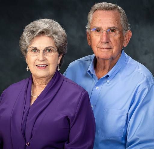 A man and a woman are posing for a picture together