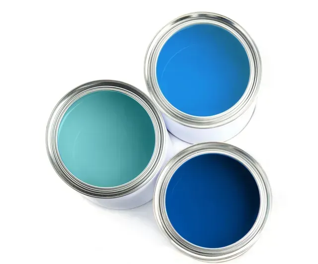 Three open paint cans with blue and teal paint on a white background