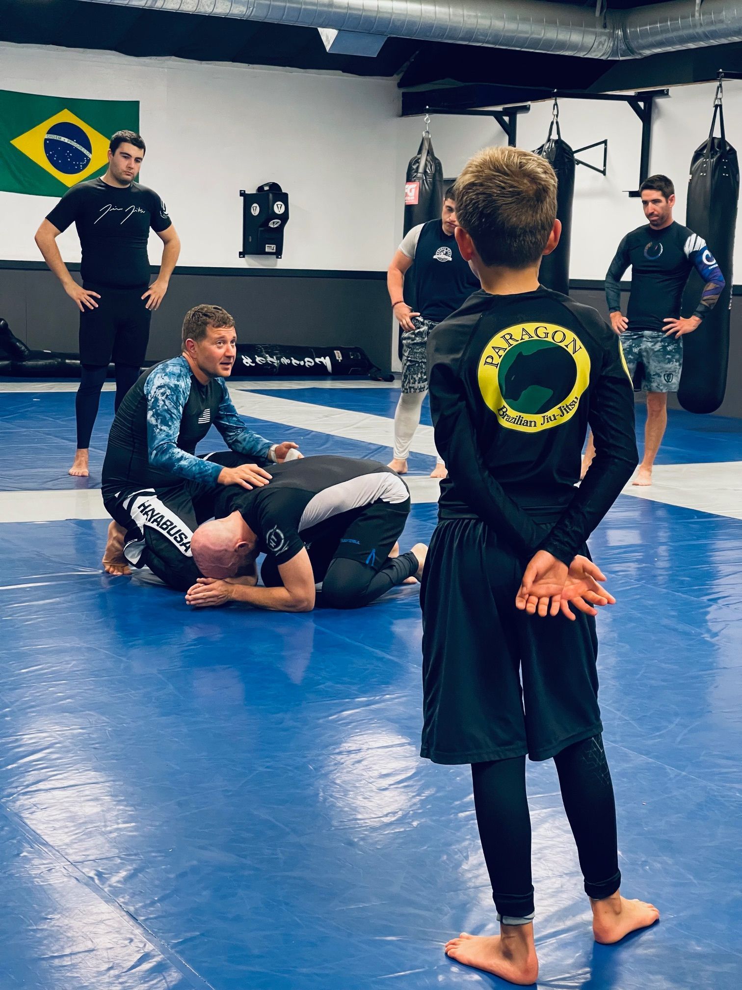 Students practicing Brazilian jiu jitsu drills at Paragon Simi Valley in Simi Valley, CA for confidence and fitness.