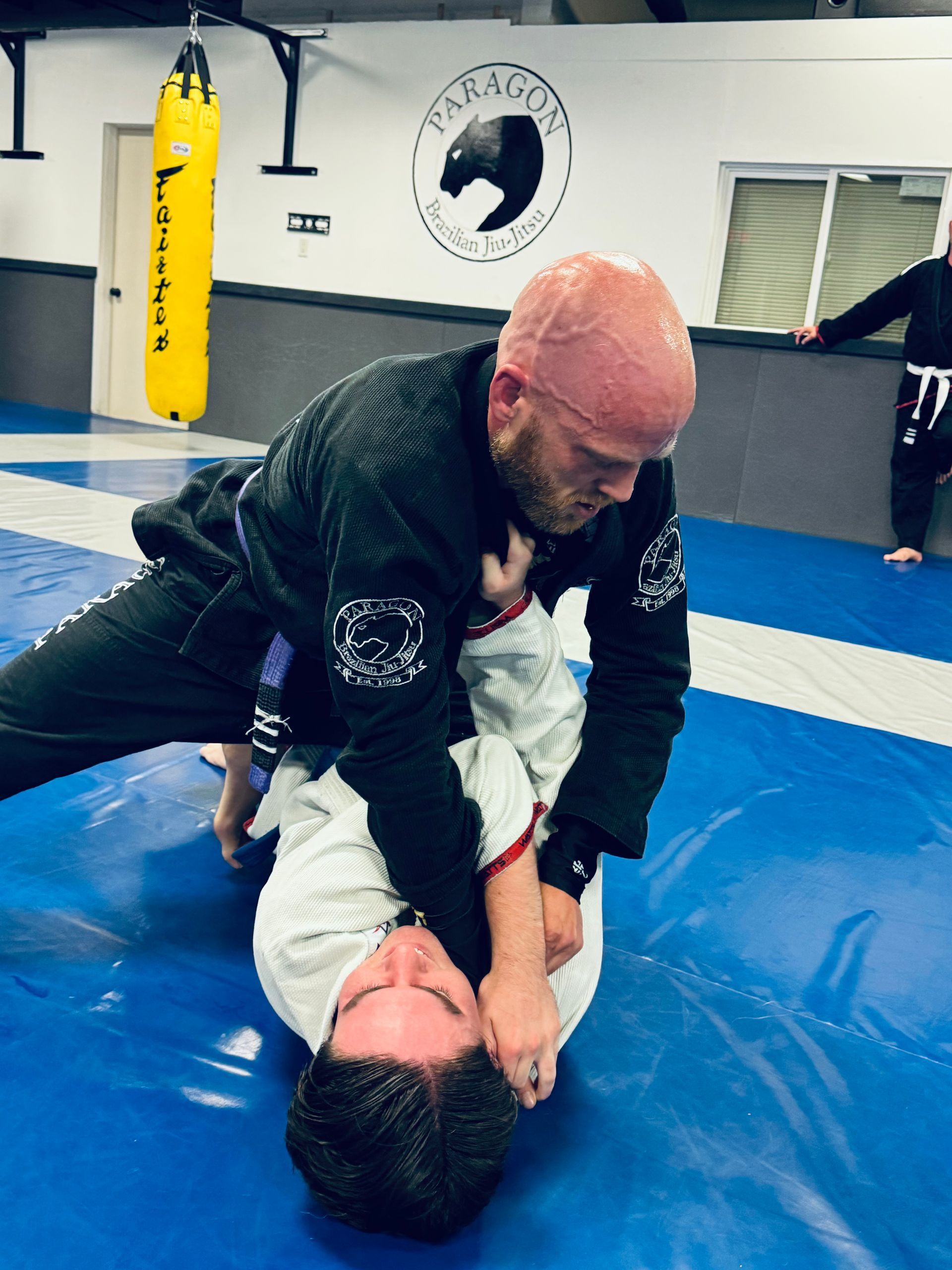 Students drilling brazilian jiu jitsu techniques at Paragon Simi Valley in Simi Valley, CA, building focus and balance