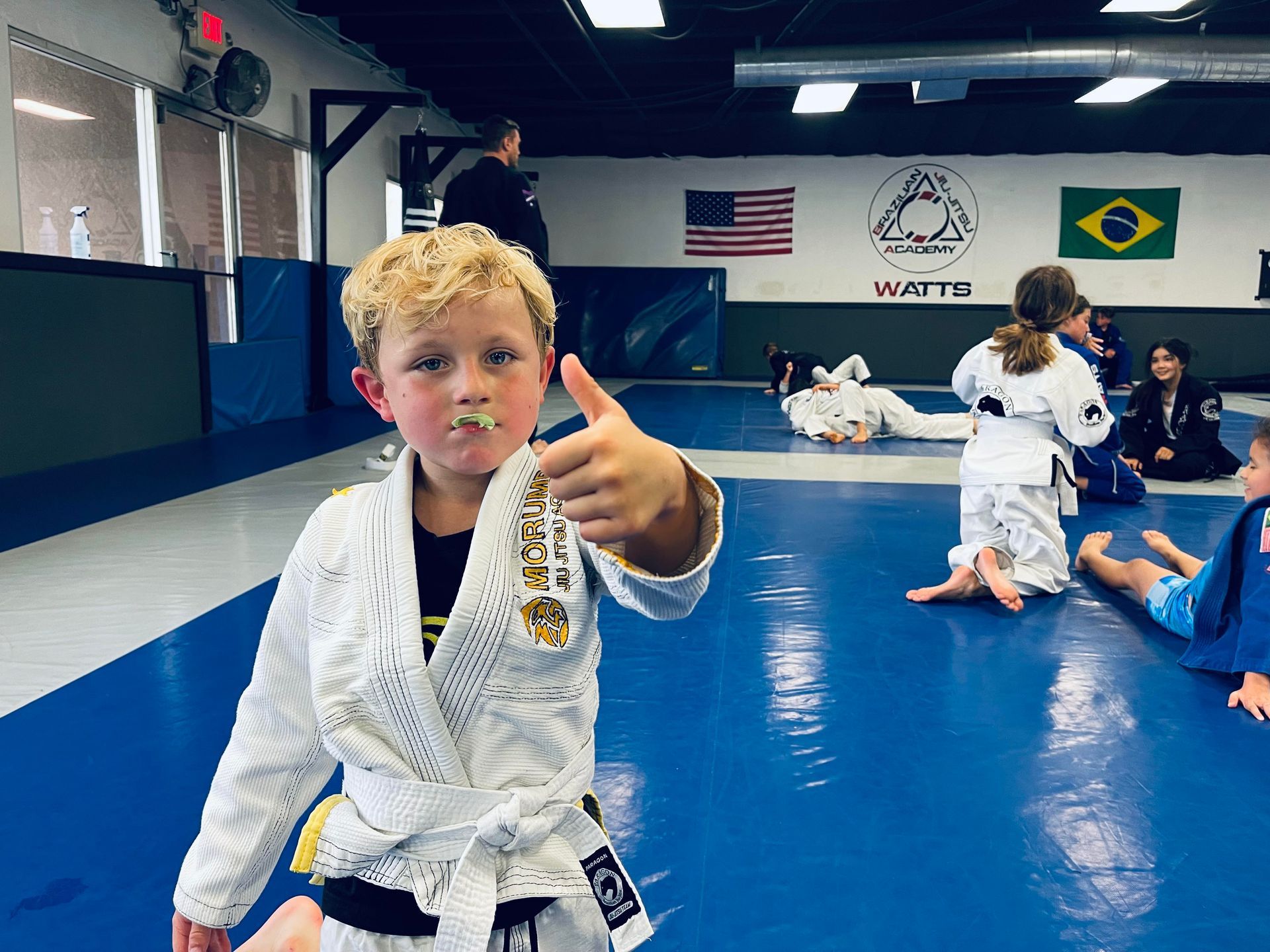 Students drilling brazilian jiu jitsu technique at Paragon Simi Valley in Simi Valley, CA to build confidence.