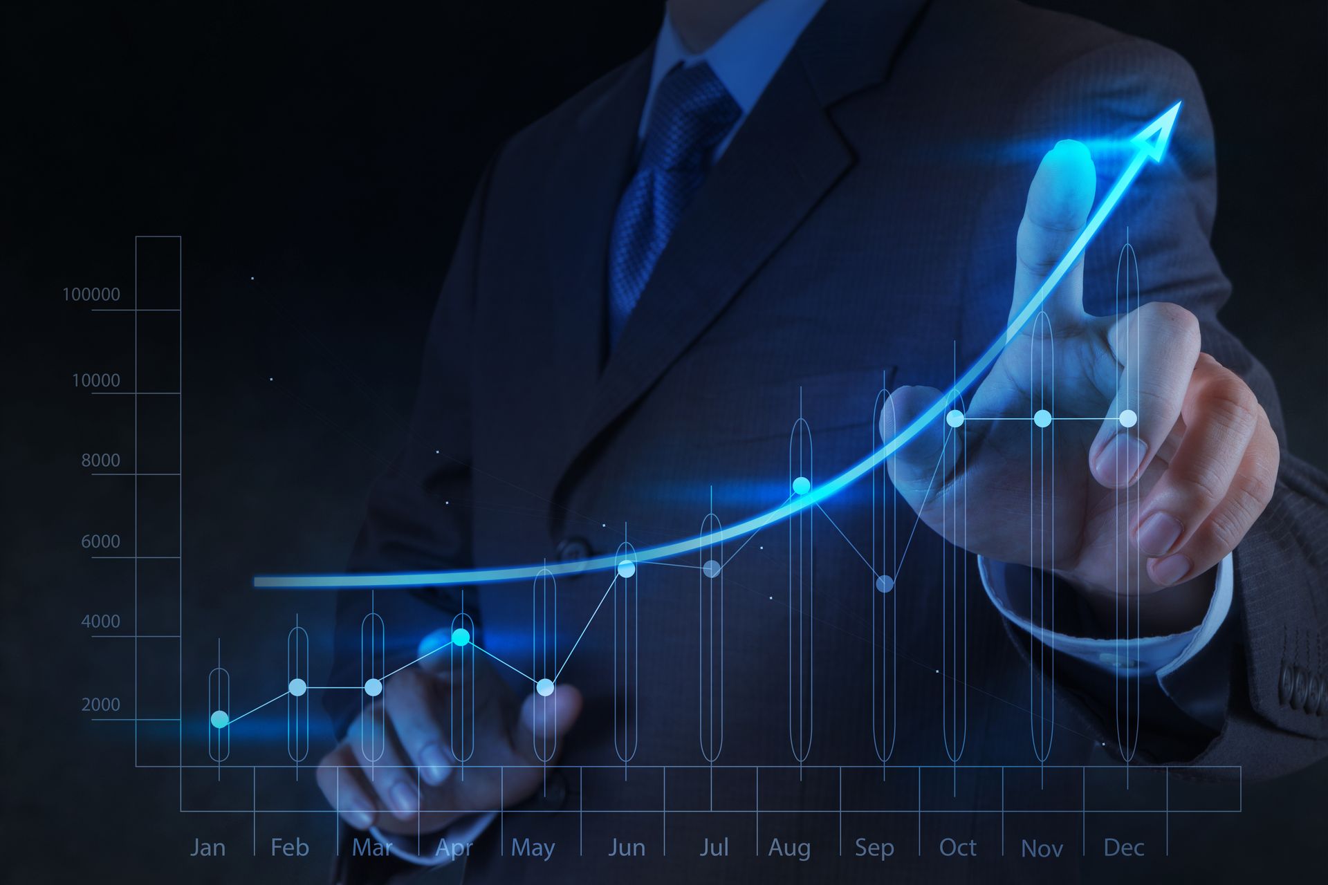 Businessman touching a glowing blue upward chart on a digital dashboard