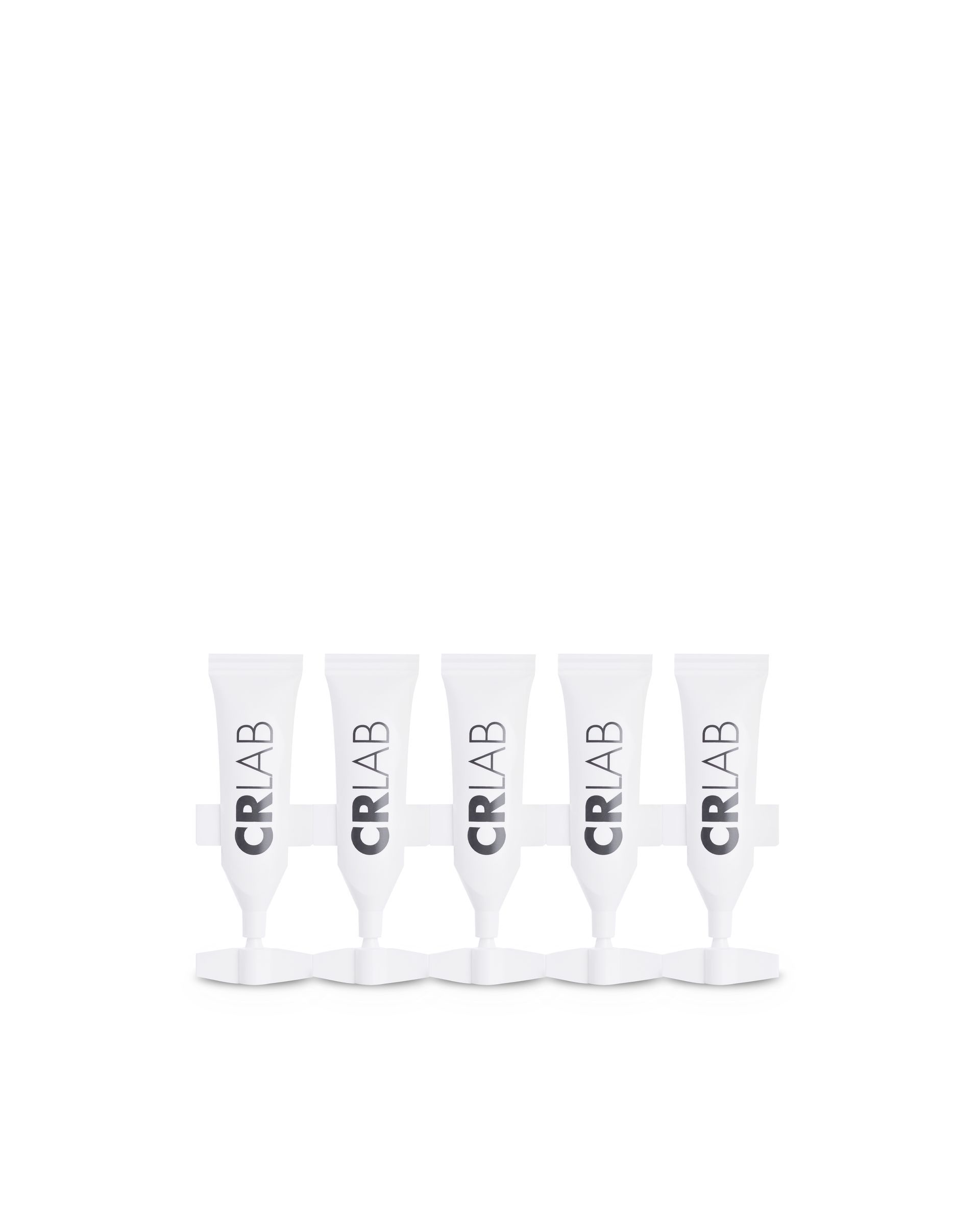 Five CRLAB anti-dandruff vials in white with purple branding arranged in single row