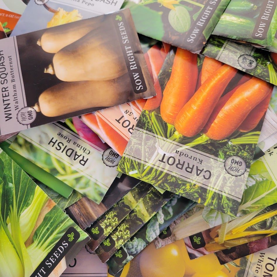 A pile of seed packets for the Lunenburg Seed Library
