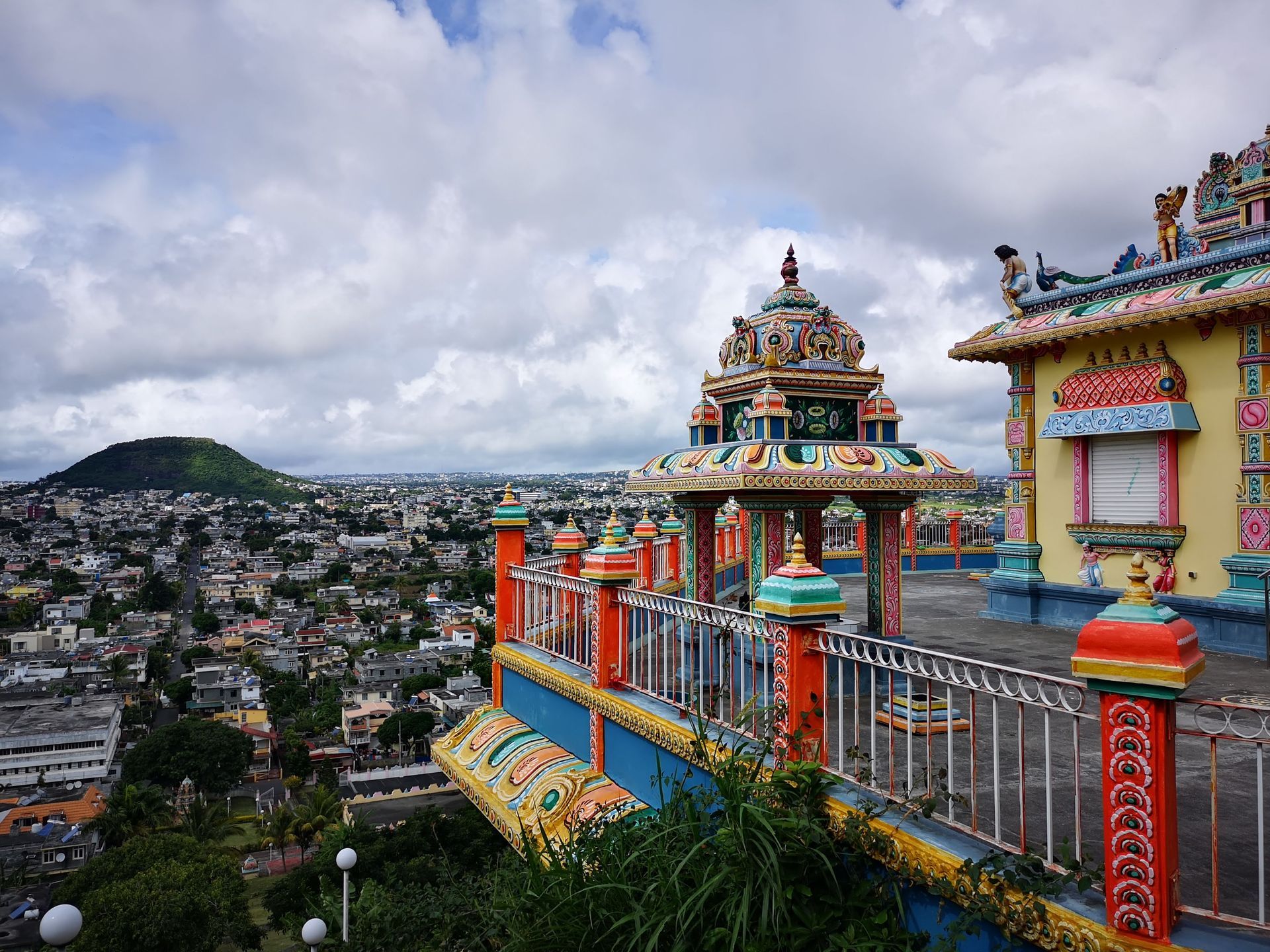 A view of a city from the top of a Corde De Gaurd Mountain in Mauritius at a Temple