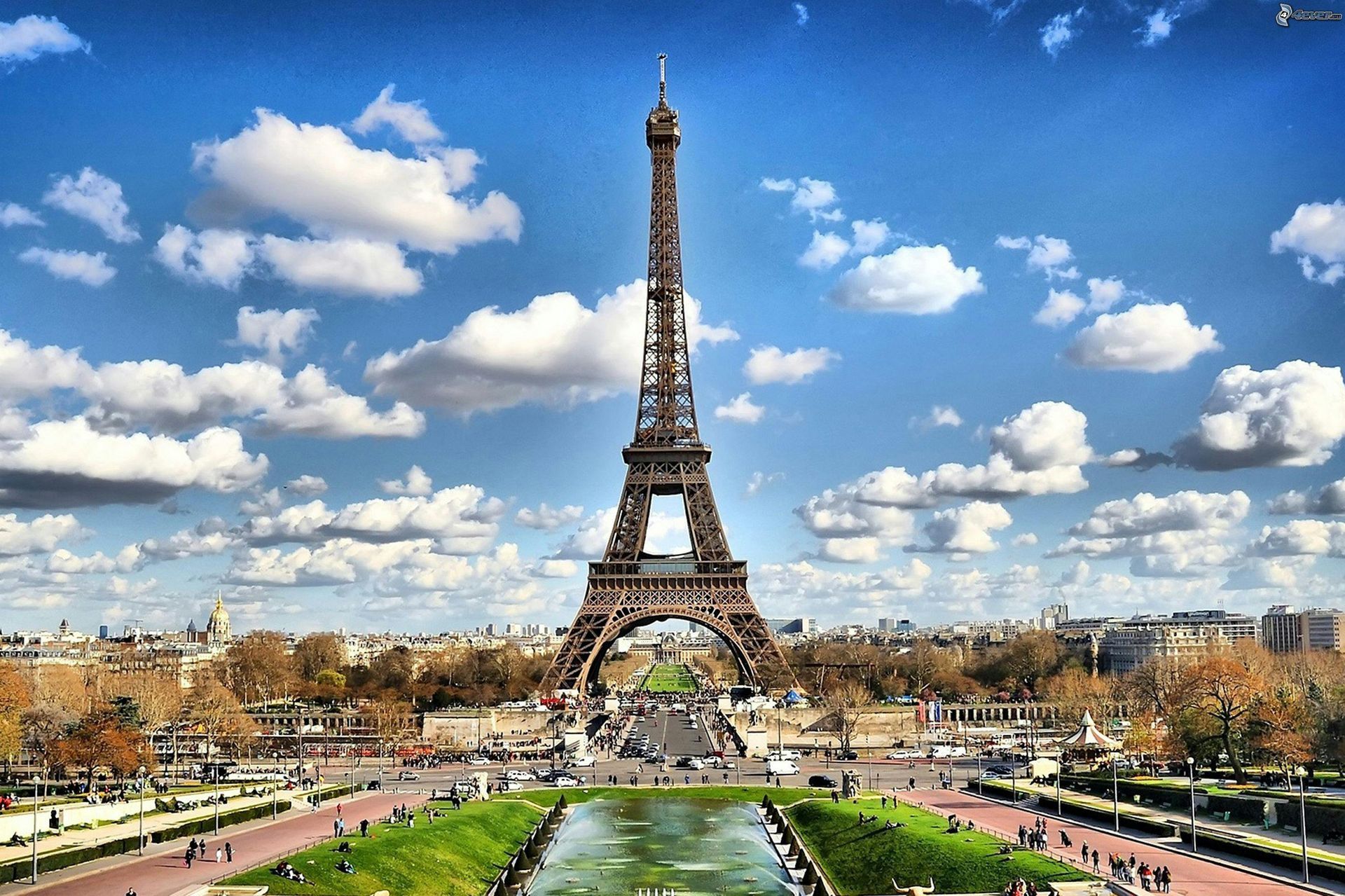The eiffel tower is against a blue sky in paris