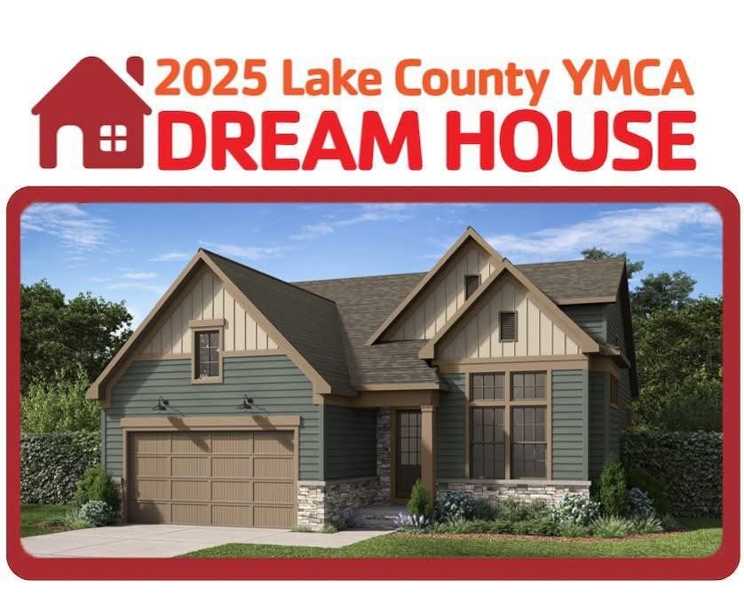 A rendering of the 2025 Lake County YMCA Dream House featuring a suburban home with gray siding and stone accents.