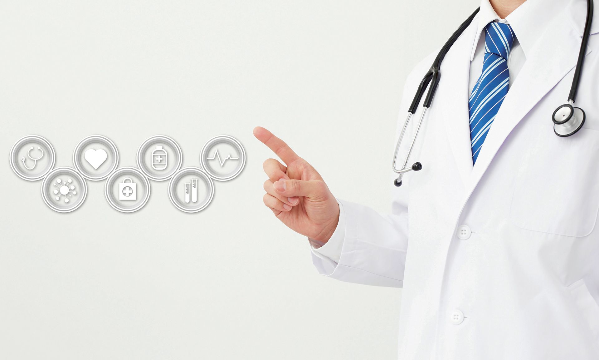 A medical professional in a white coat and stethoscope gestures toward a cluster of floating healthcare icons.