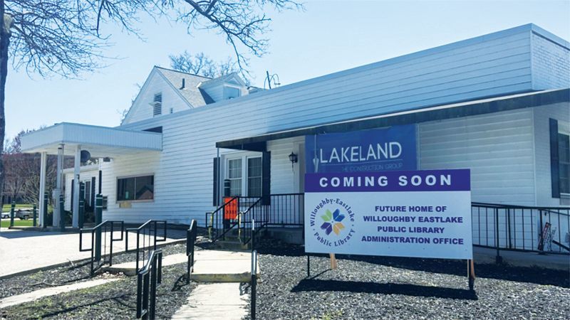 A white building with a sign announcing it is the future home of the Willoughby-Eastlake Public Library Administration.