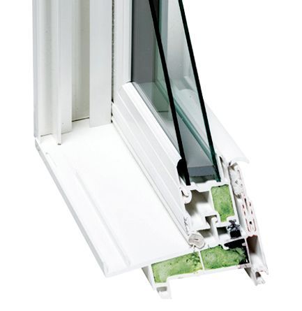A cross-section of a white vinyl window frame showing double-pane glass and internal foam insulation chambers.
