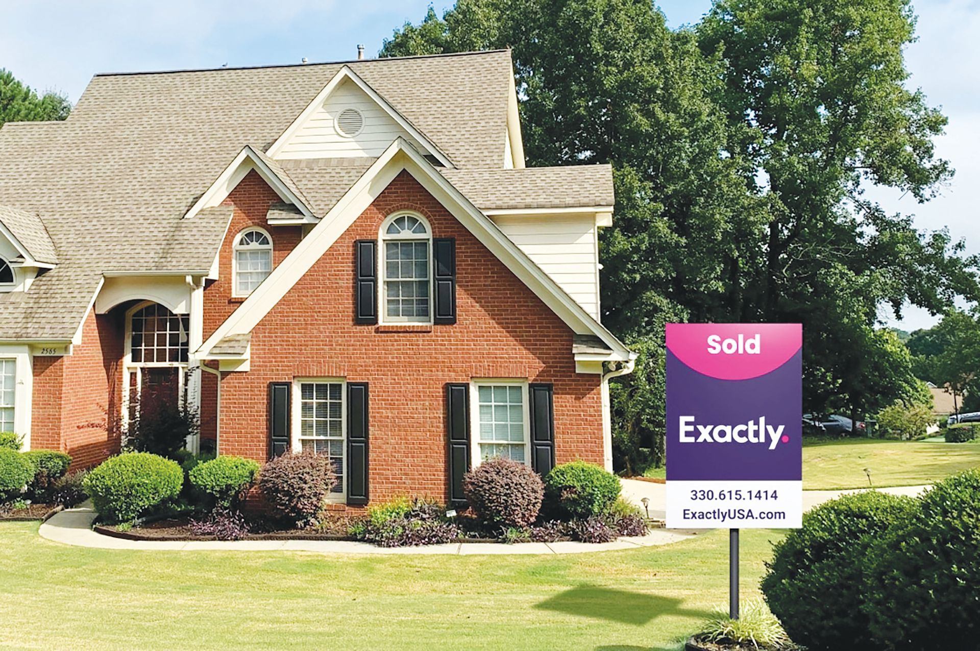 A red brick two-story house with an