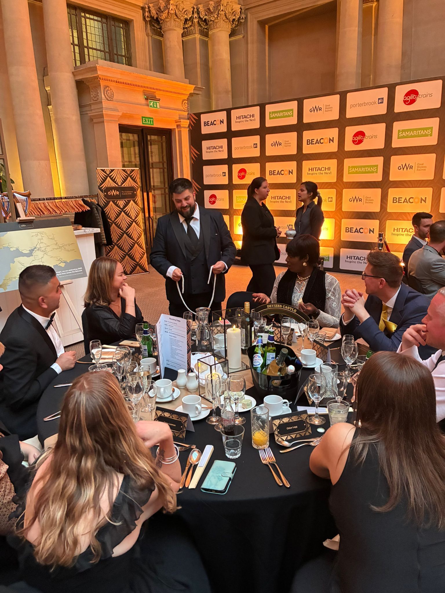 Daniel Chard performing table magic for guests at a corporate dinner