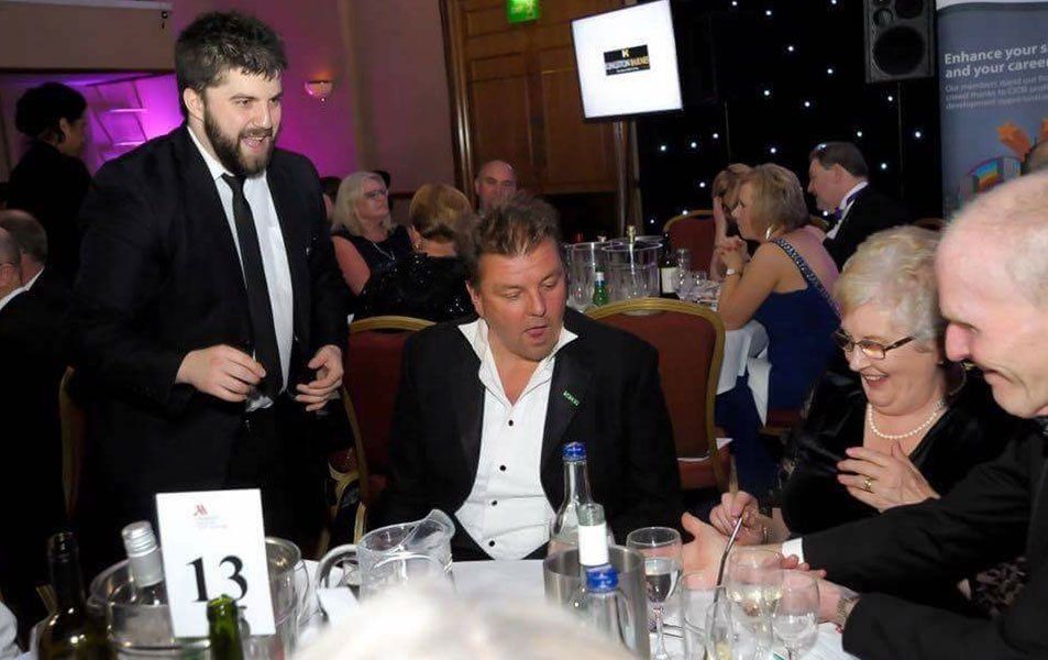 Corporate magician Daniel Chard performing interactive close-up magic at a corporate event